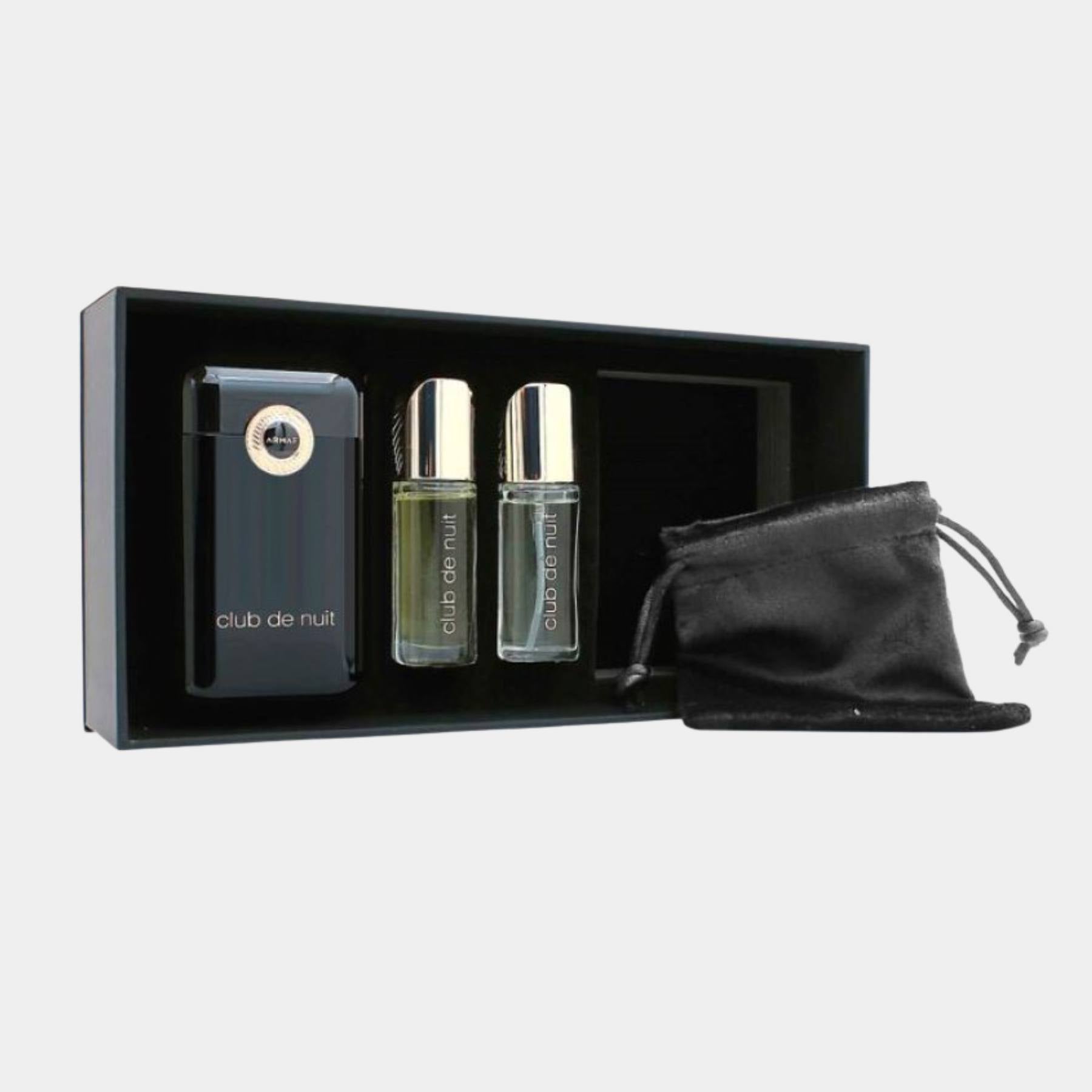 Perfume set with two bottles and a pouch in a black box labeled 'club de nuit'.